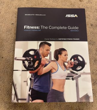 The cover of the ISSA CPT Personal Trainer Textbook