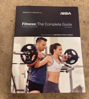 The cover of the ISSA CPT Personal Trainer Textbook
